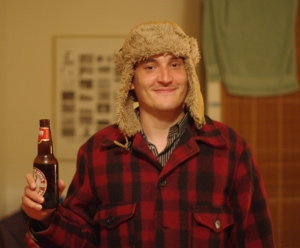 me in Canada, wearing a slumber jacket, a tuque and a Canadian beer